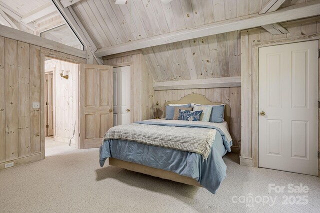 carpeted bedroom with wooden walls and wood ceiling