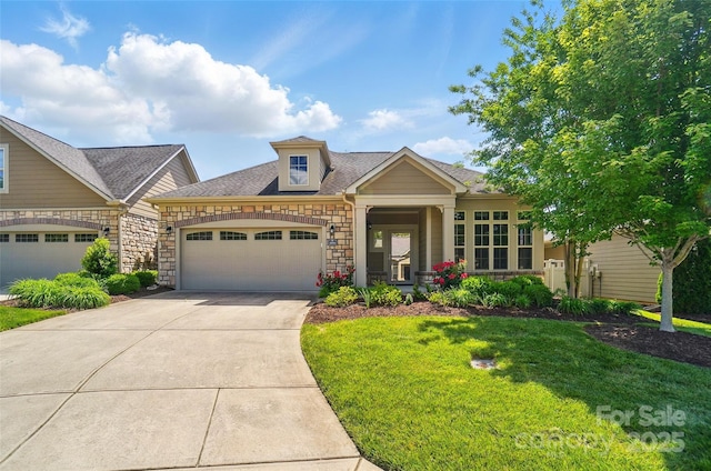 5028 Polo Gate Blvd, Charlotte, NC 28216 - view of front facade with a garage, stone siding, driveway, and a front lawn