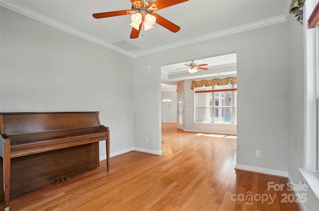 5028 Polo Gate Blvd, Charlotte, NC 28216 - unfurnished room featuring crown molding, baseboards, a ceiling fan, and light wood-type flooring