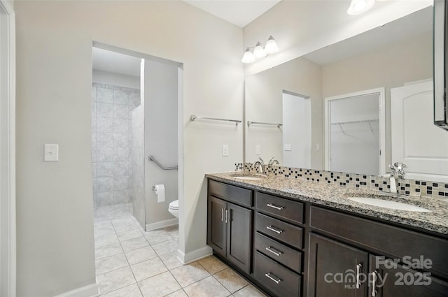 5028 Polo Gate Blvd, Charlotte, NC 28216 - bathroom featuring tile patterned floors, walk in shower, double vanity, toilet, and baseboards
