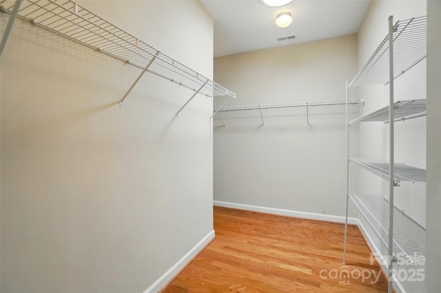 5028 Polo Gate Blvd, Charlotte, NC 28216 - spacious closet with wood finished floors