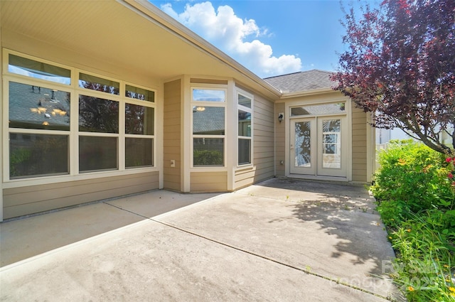 5028 Polo Gate Blvd, Charlotte, NC 28216 - property entrance featuring a patio area, a shingled roof, and french doors