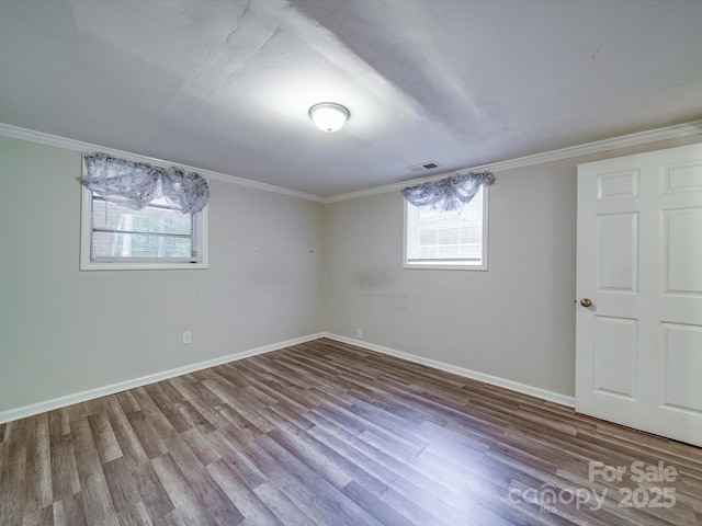 363 Sowers Rd, Linwood, NC 27299 - below grade area with healthy amount of natural light, wood finished floors, baseboards, and crown molding