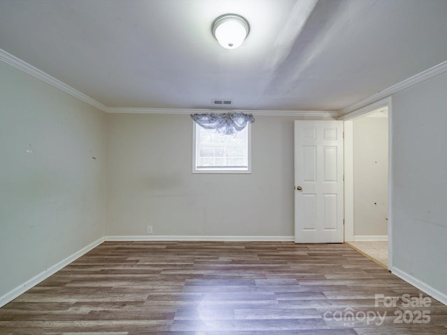363 Sowers Rd, Linwood, NC 27299 - basement featuring wood finished floors, crown molding, and baseboards