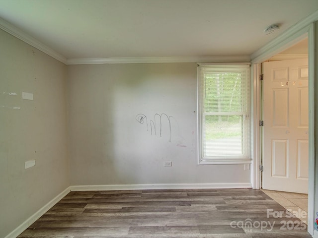 363 Sowers Rd, Linwood, NC 27299 - spare room with a smoke detector, wood finished floors, crown molding, and baseboards