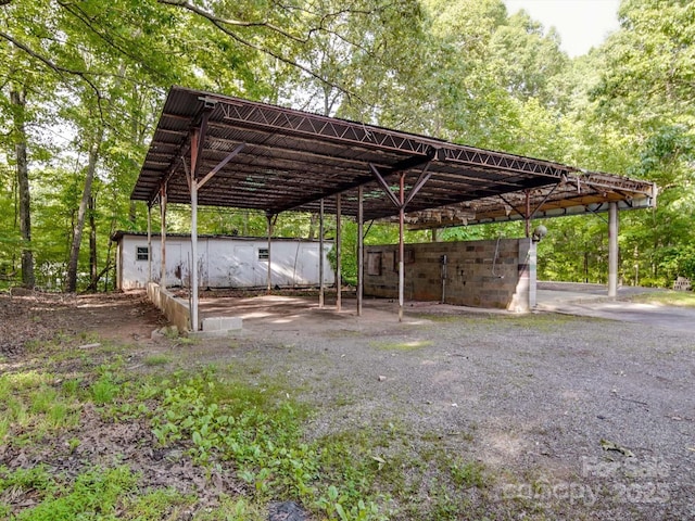 363 Sowers Rd, Linwood, NC 27299 - view of parking with a carport and gravel driveway