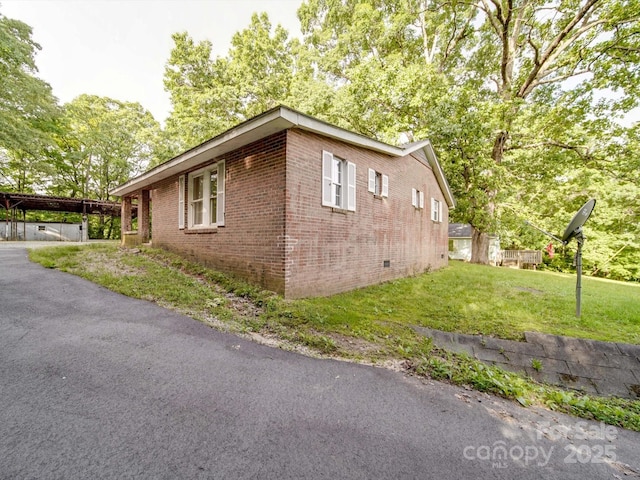 363 Sowers Rd, Linwood, NC 27299 - view of side of home featuring brick siding, a yard, and crawl space