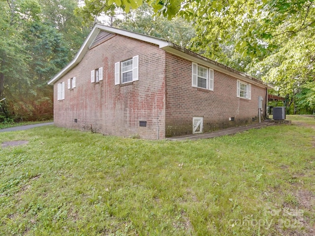 363 Sowers Rd, Linwood, NC 27299 - view of home's exterior featuring crawl space, central AC unit, a lawn, and brick siding