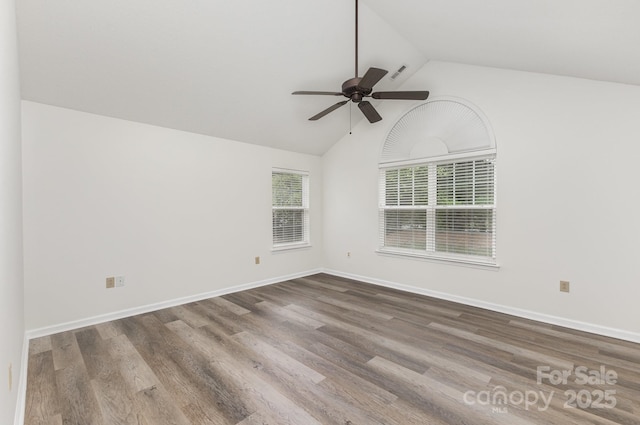 unfurnished room with a ceiling fan, baseboards, high vaulted ceiling, and wood finished floors