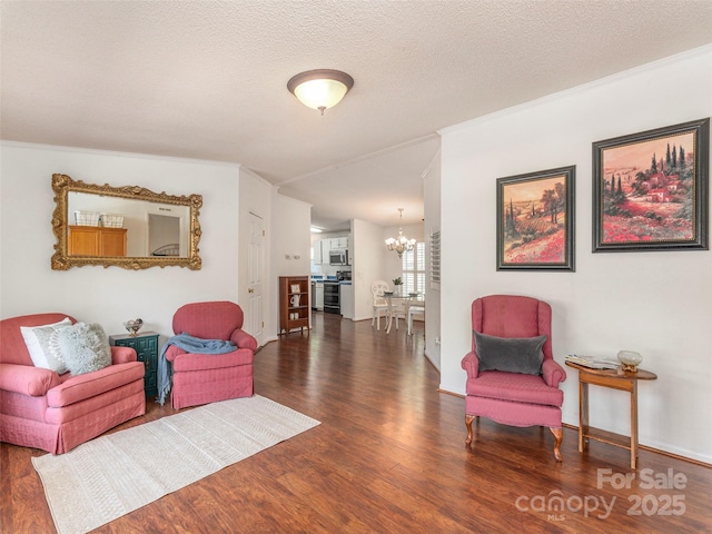 9 Redmond Dr, Alexander, NC 28701 - living room with a chandelier, crown molding, a textured ceiling, and wood finished floors