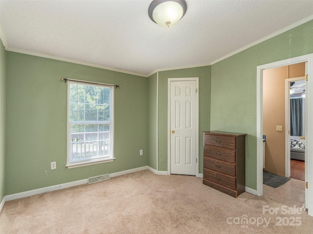 9 Redmond Dr, Alexander, NC 28701 - unfurnished bedroom featuring crown molding, a textured ceiling, baseboards, and carpet