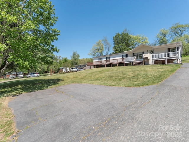 9 Redmond Dr, Alexander, NC 28701 - view of front of property featuring a porch and a front yard