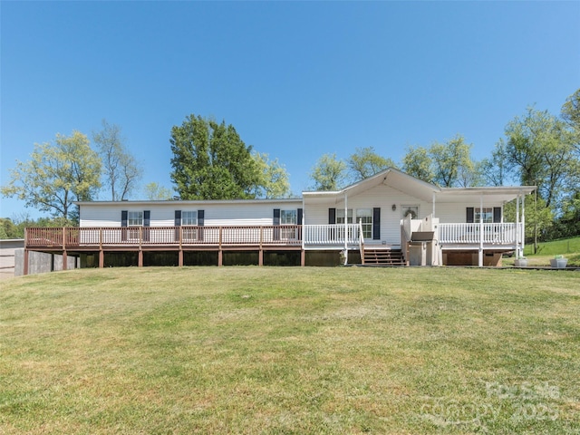 9 Redmond Dr, Alexander, NC 28701 - rear view of house with a deck and a lawn