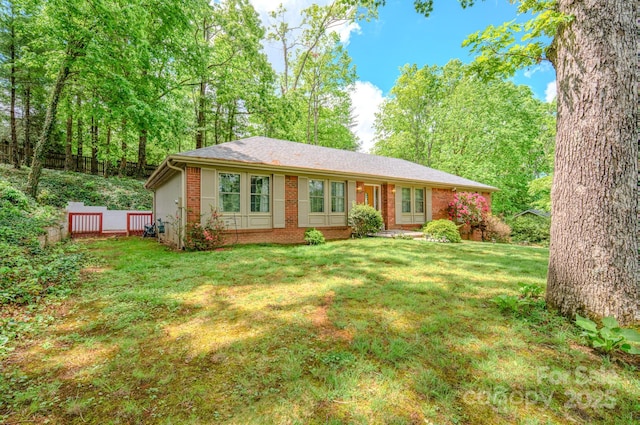6 Chipmunk Cove Rd, Asheville, NC 28804 - ranch-style house featuring fence, a front lawn, and brick siding