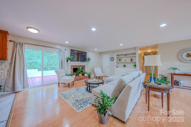 6 Chipmunk Cove Rd, Asheville, NC 28804 - living area featuring built in features, a fireplace, light wood-style flooring, and recessed lighting