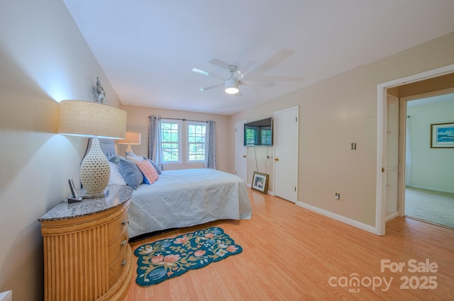 6 Chipmunk Cove Rd, Asheville, NC 28804 - bedroom featuring ceiling fan, baseboards, and light wood-type flooring