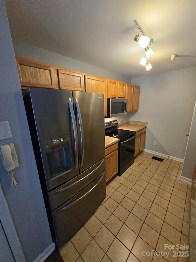 521 Donatello Ave, Charlotte, NC 28205 - kitchen with appliances with stainless steel finishes, light tile patterned floors, light countertops, and baseboards