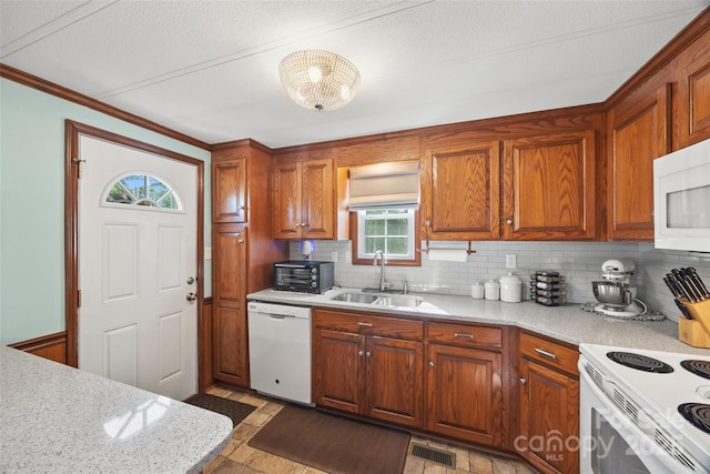 105 Carrie Ln Unit 3, Cherryville, NC 28021 - kitchen featuring a sink, white appliances, a healthy amount of sunlight, visible vents, and backsplash