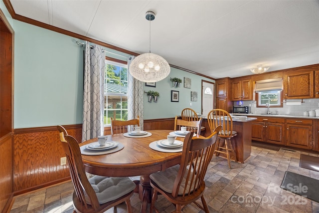 105 Carrie Ln Unit 3, Cherryville, NC 28021 - dining area featuring wainscoting, ornamental molding, and stone tile flooring
