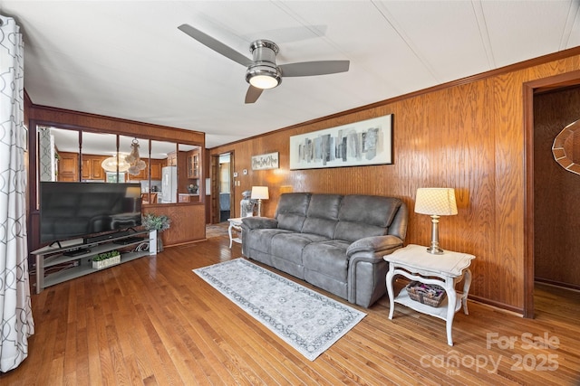 105 Carrie Ln Unit 3, Cherryville, NC 28021 - living area with wooden walls, a ceiling fan, and hardwood / wood-style flooring