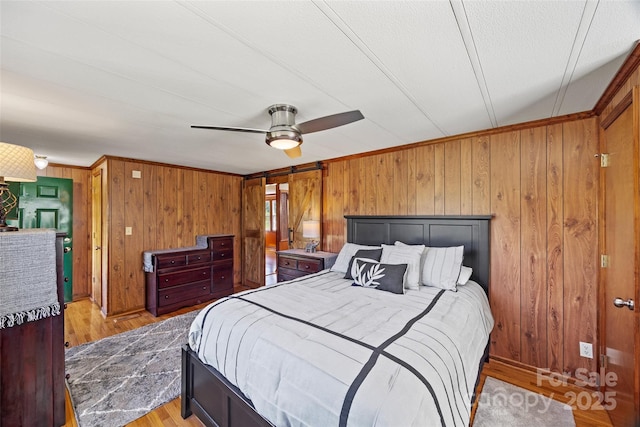 105 Carrie Ln Unit 3, Cherryville, NC 28021 - bedroom with ceiling fan, wood walls, crown molding, and wood finished floors