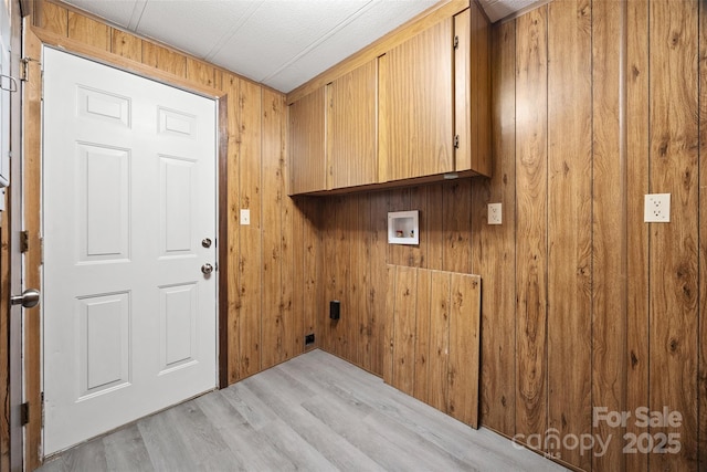 105 Carrie Ln Unit 3, Cherryville, NC 28021 - laundry area with washer hookup, wooden walls, light wood finished floors, and cabinet space