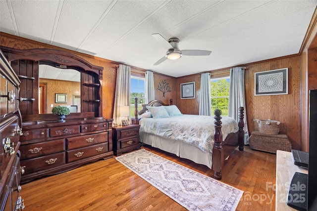 105 Carrie Ln Unit 3, Cherryville, NC 28021 - bedroom featuring multiple windows, wooden walls, and wood finished floors