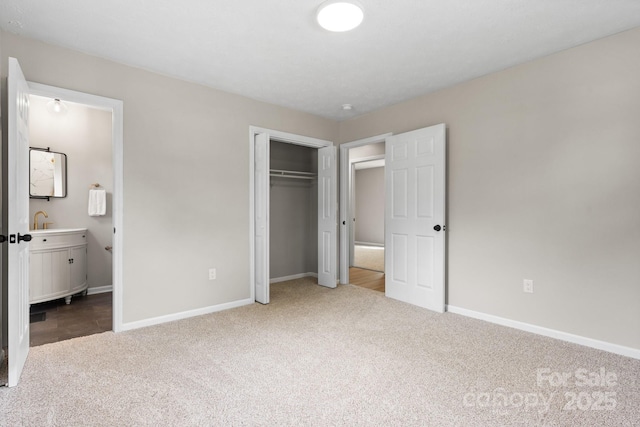 606 Hillcrest St, Hudson, NC 28638 - unfurnished bedroom with a closet, ensuite bath, baseboards, and dark carpet