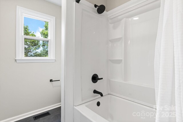 606 Hillcrest St, Hudson, NC 28638 - bathroom with baseboards, shower / tub combo with curtain, and visible vents
