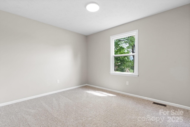 606 Hillcrest St, Hudson, NC 28638 - carpeted spare room with baseboards and visible vents