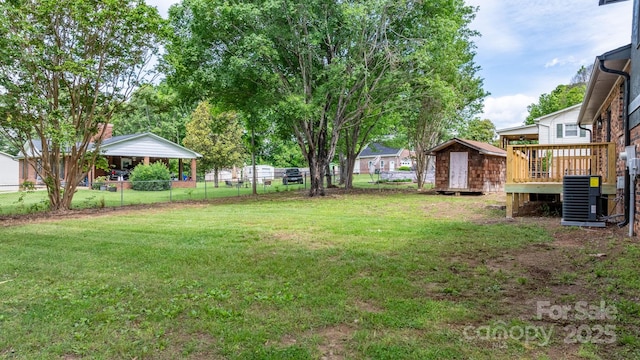 606 Hillcrest St, Hudson, NC 28638 - view of yard with cooling unit, an outbuilding, a deck, and fence