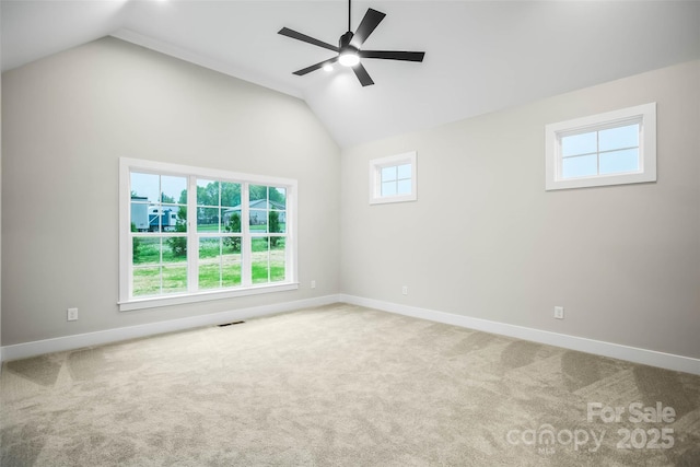 spare room featuring carpet, baseboards, a ceiling fan, and visible vents