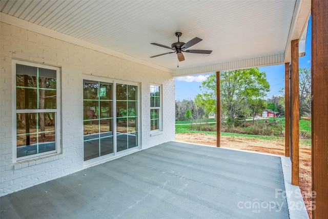 exterior space featuring a wealth of natural light and a ceiling fan