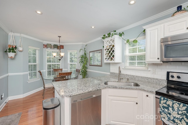 600 Old Hardin Rd, Dallas, NC 28034 - kitchen with light wood finished floors, a peninsula, a sink, white cabinetry, and appliances with stainless steel finishes