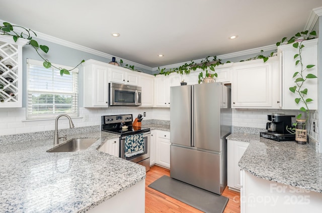 600 Old Hardin Rd, Dallas, NC 28034 - kitchen featuring a sink, stainless steel appliances, white cabinets, crown molding, and decorative backsplash