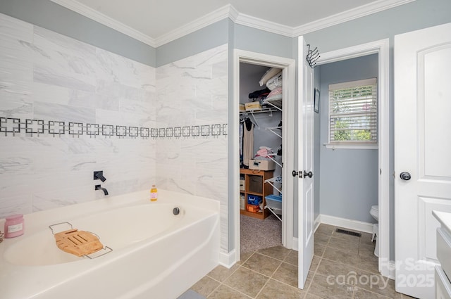 600 Old Hardin Rd, Dallas, NC 28034 - bathroom with ornamental molding, visible vents, tile patterned flooring, a walk in closet, and a garden tub
