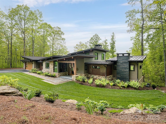 391 High Hickory Trl, Swannanoa, NC 28778 - back of property with a standing seam roof, a yard, stone siding, metal roof, and driveway