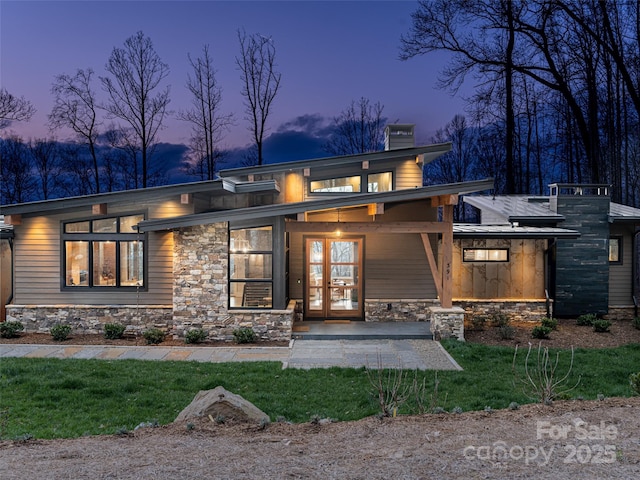391 High Hickory Trl, Swannanoa, NC 28778 - back of property with a chimney, stone siding, a lawn, and french doors