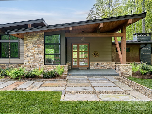 391 High Hickory Trl, Swannanoa, NC 28778 - doorway to property with stone siding and covered porch