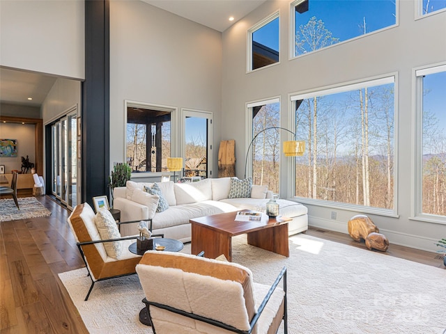 391 High Hickory Trl, Swannanoa, NC 28778 - living room with plenty of natural light, dark wood-style flooring, a high ceiling, and recessed lighting