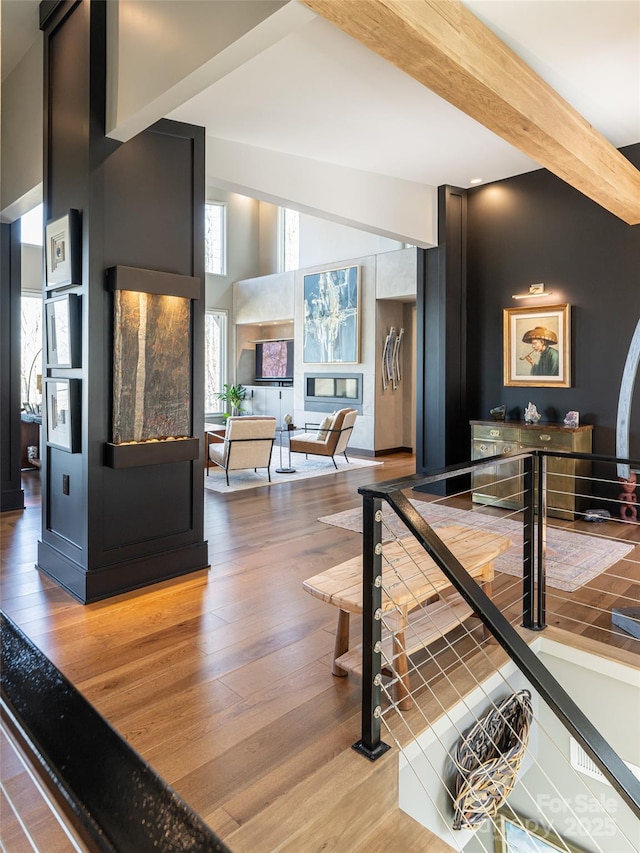 391 High Hickory Trl, Swannanoa, NC 28778 - hallway with beam ceiling, wood finished floors, and a towering ceiling