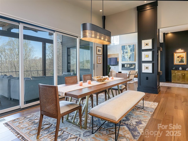 391 High Hickory Trl, Swannanoa, NC 28778 - dining area featuring light wood-style flooring, a high ceiling, and recessed lighting