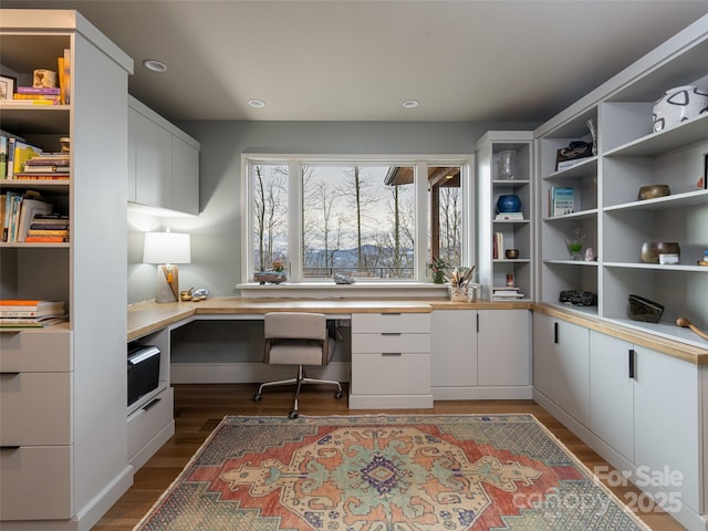 391 High Hickory Trl, Swannanoa, NC 28778 - office space with built in desk, dark wood-style floors, and recessed lighting