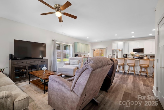 living area featuring ceiling fan, a toaster, recessed lighting, and wood finished floors