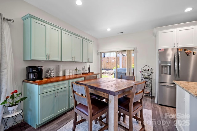 dining area featuring visible vents, recessed lighting, and dark wood-style floors
