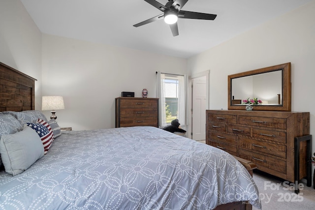 carpeted bedroom with a ceiling fan