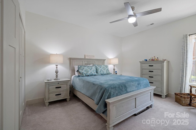 bedroom featuring baseboards, ceiling fan, light carpet, and visible vents