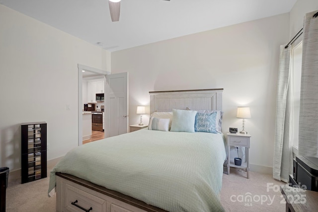 bedroom with light colored carpet and ceiling fan