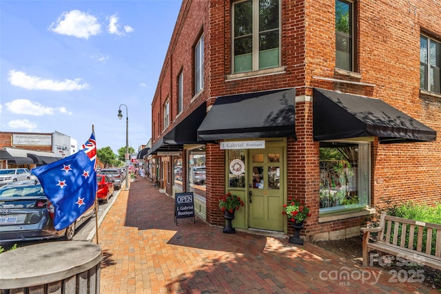 exterior space with brick siding