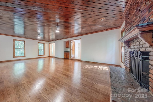 2310 Vestry Pl, Charlotte, NC 28270 - unfurnished living room featuring crown molding, wood ceiling, a brick fireplace, baseboards, and wood finished floors